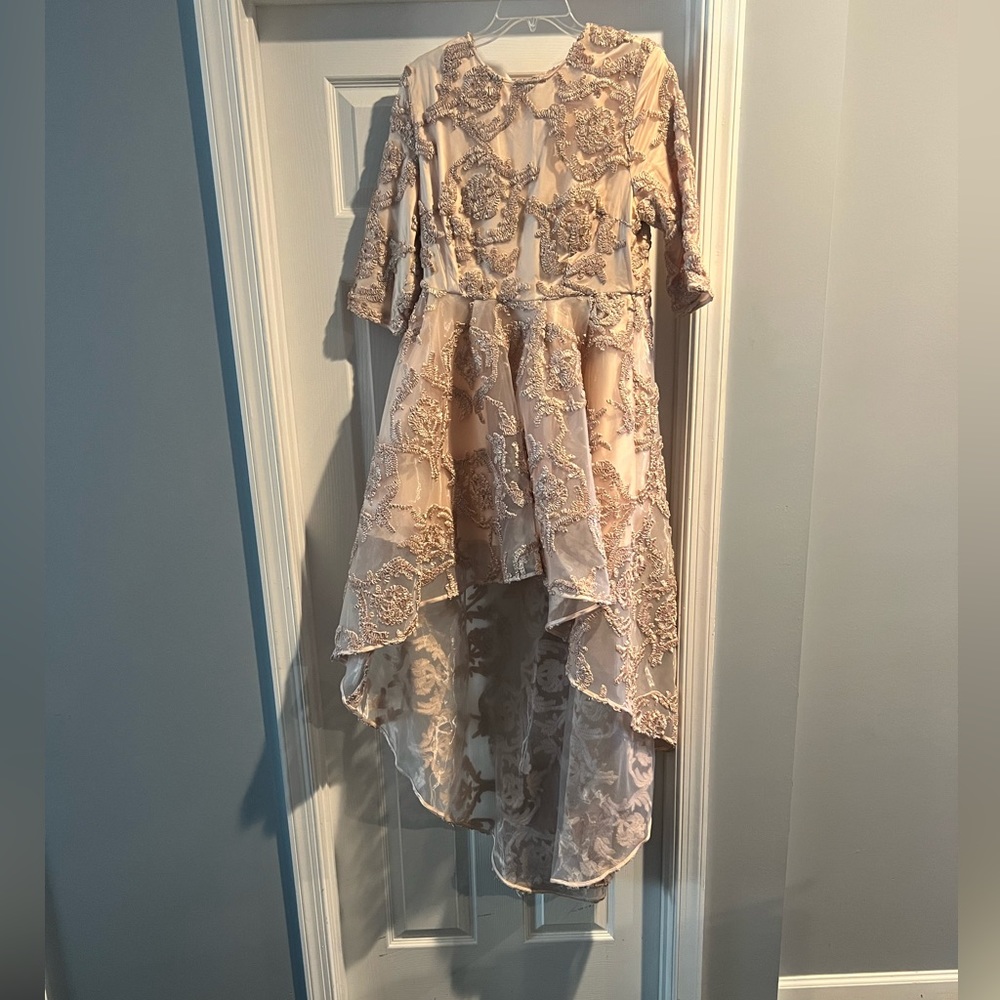 Beige high low dress.